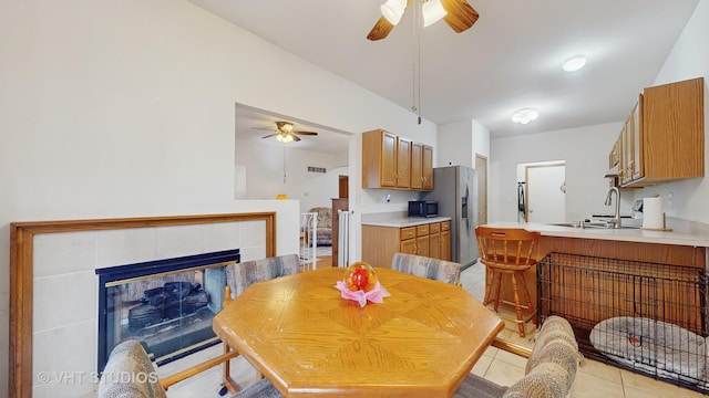 832 Veridian Way Unit 832, Cary, IL 60013 - dining room featuring a ceiling fan, light tile patterned floors, and a fireplace