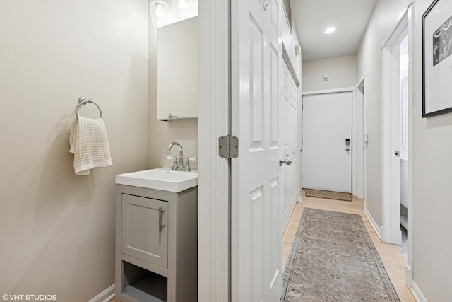 1048 W Lill Ave Unit 2, Chicago, IL 60614 - bathroom featuring vanity and wood finished floors