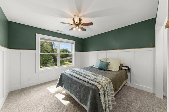 523 Kipling Ct, Wheaton, IL 60187 - carpeted bedroom with a decorative wall, wainscoting, and ceiling fan