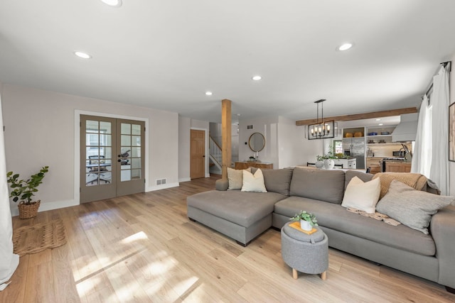 523 Kipling Ct, Wheaton, IL 60187 - living room featuring recessed lighting, light wood-style floors, stairway, french doors, and a chandelier