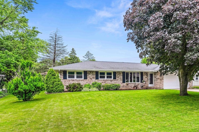 207 Hammitt Dr, Normal, IL 61761 - ranch-style house featuring a garage, brick siding, a front yard, and driveway