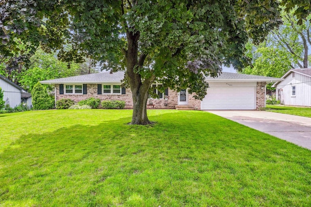 207 Hammitt Dr, Normal, IL 61761 - view of front facade featuring driveway, brick siding, a front yard, and a garage