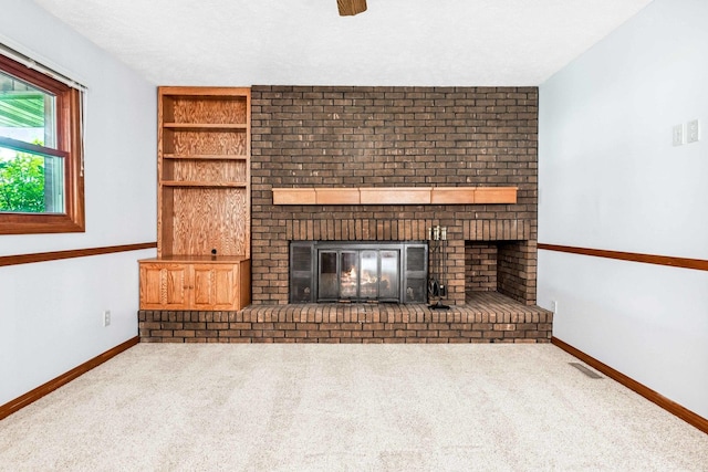 207 Hammitt Dr, Normal, IL 61761 - unfurnished living room with a fireplace and carpet floors