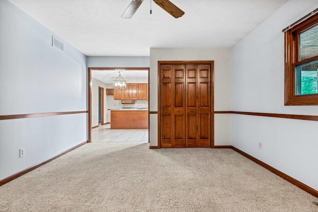 207 Hammitt Dr, Normal, IL 61761 - empty room with light colored carpet and a ceiling fan