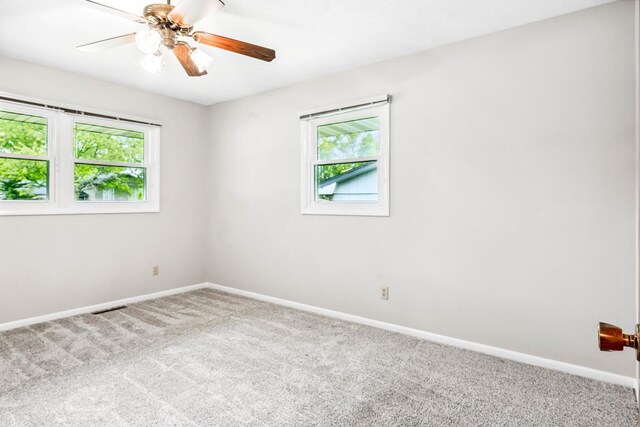 207 Hammitt Dr, Normal, IL 61761 - spare room with carpet floors, plenty of natural light, and a ceiling fan
