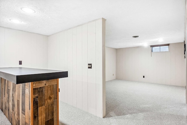 207 Hammitt Dr, Normal, IL 61761 - indoor dry bar featuring carpet, wooden walls, recessed lighting, and a textured ceiling