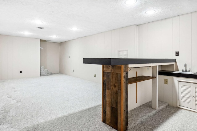 207 Hammitt Dr, Normal, IL 61761 - finished basement with carpet, a textured ceiling, a decorative wall, and recessed lighting