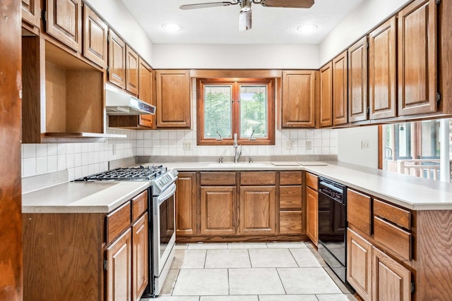 207 Hammitt Dr, Normal, IL 61761 - kitchen with stainless steel gas stove, under cabinet range hood, black dishwasher, a peninsula, and brown cabinetry
