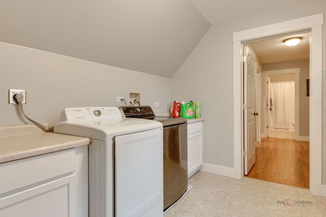 20760 N Florence Ave, Lincolnshire, IL 60069 - washroom featuring washing machine and clothes dryer, cabinet space, and light tile patterned flooring