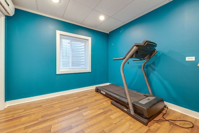 20760 N Florence Ave, Lincolnshire, IL 60069 - exercise area featuring a wall unit AC, recessed lighting, and wood finished floors