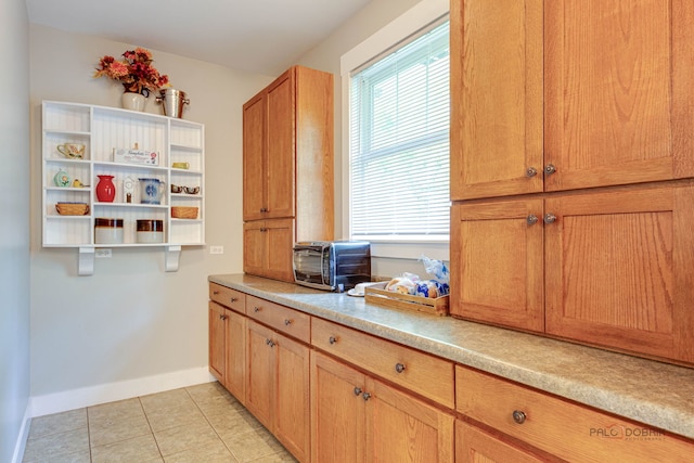 20760 N Florence Ave, Lincolnshire, IL 60069 - kitchen featuring open shelves, light tile patterned floors, and light countertops