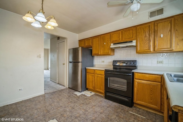 9423 Bay Colony Dr Unit 3N, Des Plaines, IL 60016 - kitchen with black electric range oven, freestanding refrigerator, under cabinet range hood, brown cabinetry, and light countertops