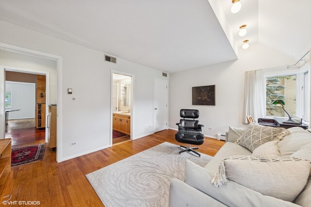 761 Revere Rd, Glen Ellyn, IL 60137 - living room featuring wood finished floors, lofted ceiling, and baseboard heating