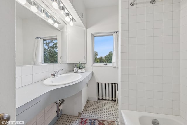 761 Revere Rd, Glen Ellyn, IL 60137 - full bath with radiator heating unit, tile patterned floors, tasteful backsplash, and shower / bathtub combination