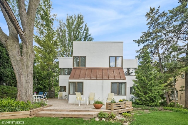 761 Revere Rd, Glen Ellyn, IL 60137 - rear view of house featuring stucco siding, a standing seam roof, a wooden deck, a lawn, and a metal roof