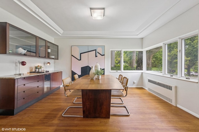 761 Revere Rd, Glen Ellyn, IL 60137 - dining room featuring radiator, a tray ceiling, and wood finished floors