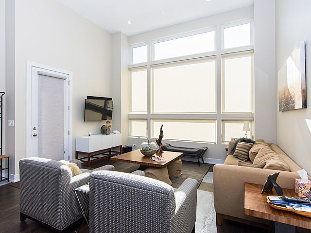 2036 W Huron St, Chicago, IL 60612 - living area with dark wood-style flooring and baseboards