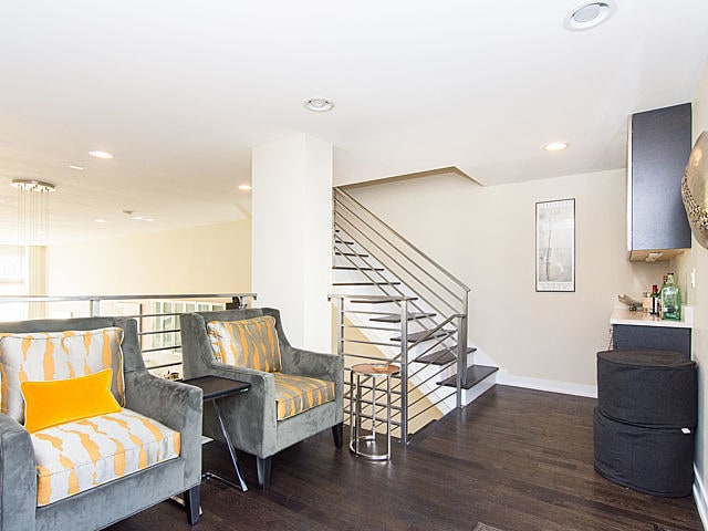2036 W Huron St, Chicago, IL 60612 - living area with wood finished floors, stairs, and recessed lighting