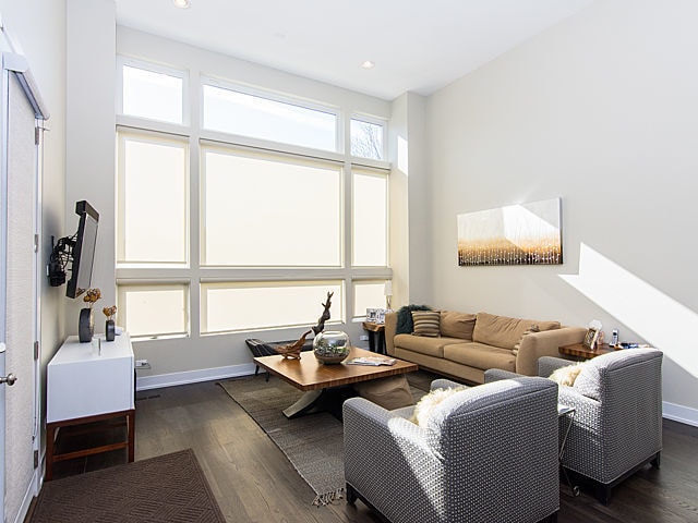 2036 W Huron St, Chicago, IL 60612 - living room with dark wood-style floors and recessed lighting