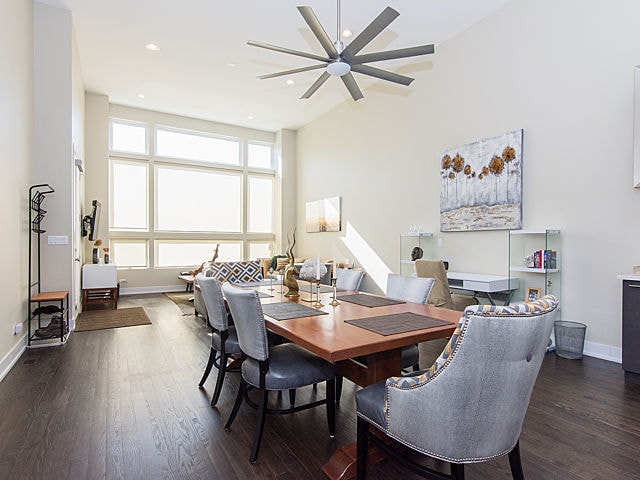 2036 W Huron St, Chicago, IL 60612 - dining space featuring dark wood-style floors, ceiling fan, recessed lighting, and high vaulted ceiling