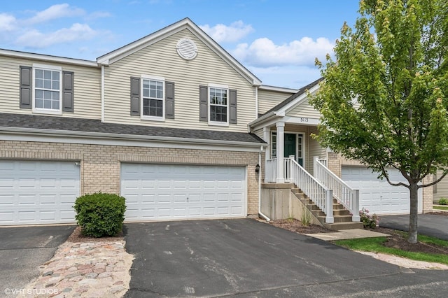 5113 Williston Ct Unit 0, Plainfield, IL 60586 - view of front of property with driveway, brick siding, and a garage