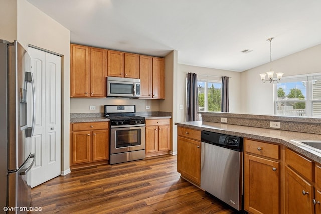 5113 Williston Ct Unit 0, Plainfield, IL 60586 - kitchen featuring appliances with stainless steel finishes, dark wood-style flooring, a chandelier, pendant lighting, and brown cabinets