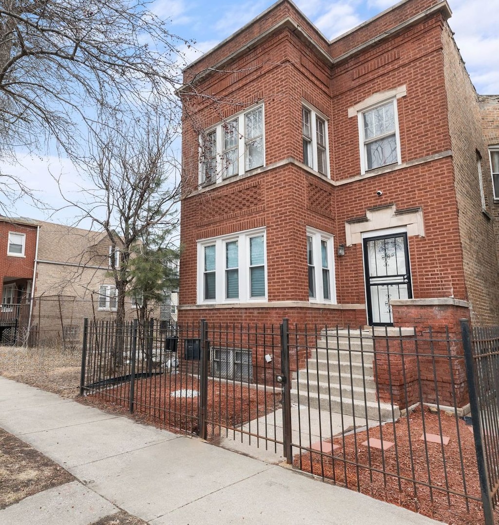6523 S Evans Ave, Chicago, IL 60637 - view of front of home with brick siding and a fenced front yard