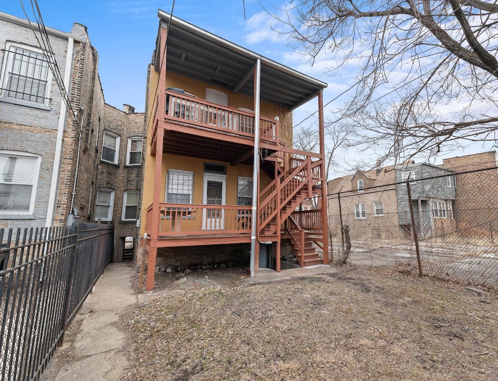 6523 S Evans Ave, Chicago, IL 60637 - rear view of property with a fenced backyard, stairway, and a deck