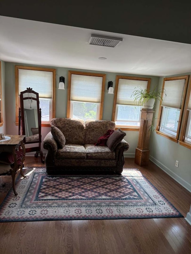 living room with wood finished floors and plenty of natural light