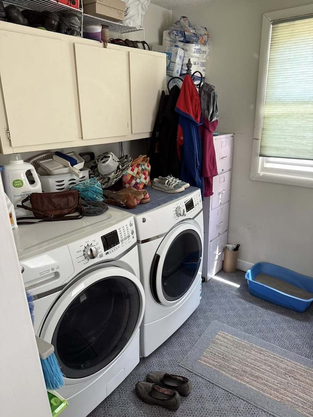 laundry area with cabinet space and washing machine and clothes dryer