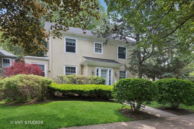 822 Clinton Pl, Evanston, IL 60201 - view of front of house with stucco siding and a front yard