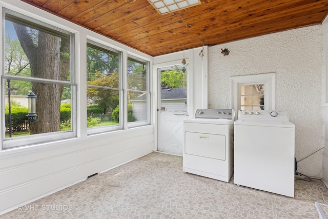 822 Clinton Pl, Evanston, IL 60201 - washroom with wood ceiling, healthy amount of natural light, and washing machine and dryer