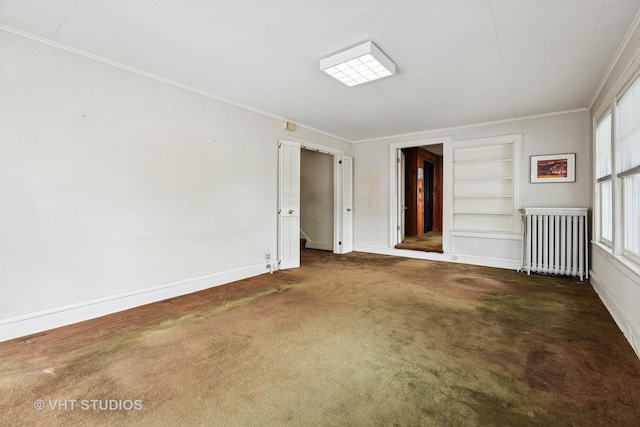 822 Clinton Pl, Evanston, IL 60201 - carpeted empty room featuring radiator, crown molding, and built in features
