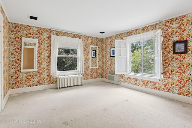 822 Clinton Pl, Evanston, IL 60201 - unfurnished room with radiator, carpet flooring, wallpapered walls, a wall mounted air conditioner, and ornamental molding