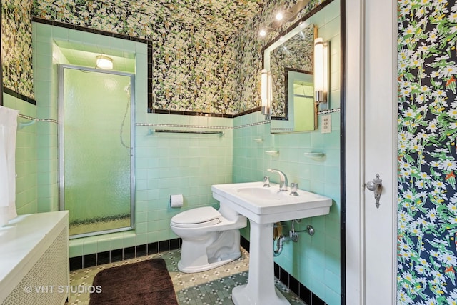 822 Clinton Pl, Evanston, IL 60201 - full bathroom with wallpapered walls, tile walls, a shower stall, and wainscoting