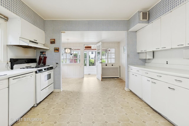 822 Clinton Pl, Evanston, IL 60201 - kitchen with white appliances, light countertops, under cabinet range hood, and white cabinets