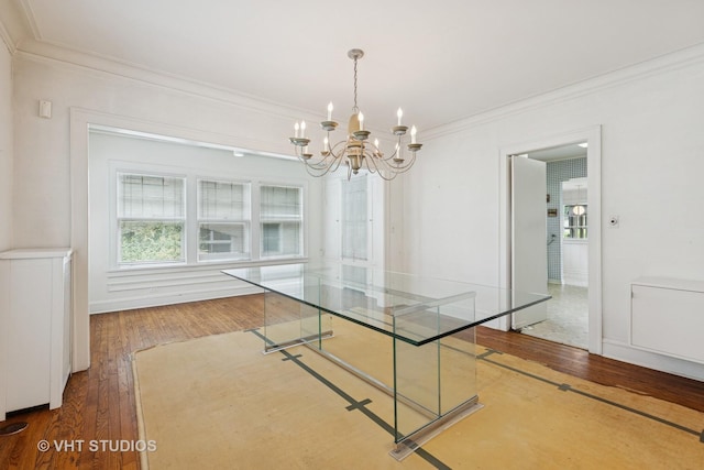 822 Clinton Pl, Evanston, IL 60201 - unfurnished dining area featuring wood-type flooring, ornamental molding, and a chandelier