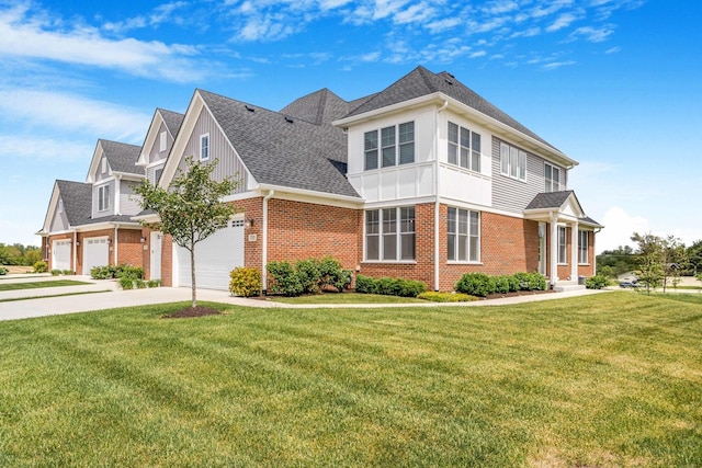 17035 Clover Dr, Orland Park, IL 60467 - view of front facade with driveway, brick siding, a front lawn, and a shingled roof