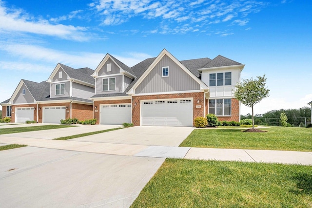17035 Clover Dr, Orland Park, IL 60467 - view of front of property with brick siding, concrete driveway, a front lawn, board and batten siding, and a garage