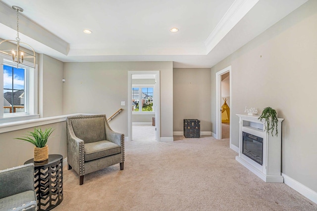 17035 Clover Dr, Orland Park, IL 60467 - sitting room featuring a raised ceiling, light colored carpet, a chandelier, a glass covered fireplace, and ornamental molding