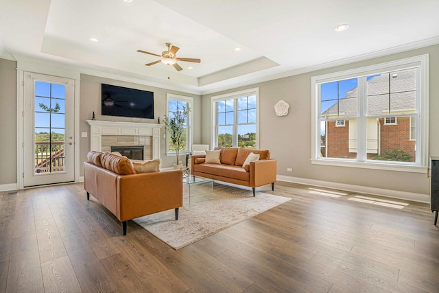17035 Clover Dr, Orland Park, IL 60467 - living area with a raised ceiling, plenty of natural light, a tile fireplace, ceiling fan, and recessed lighting