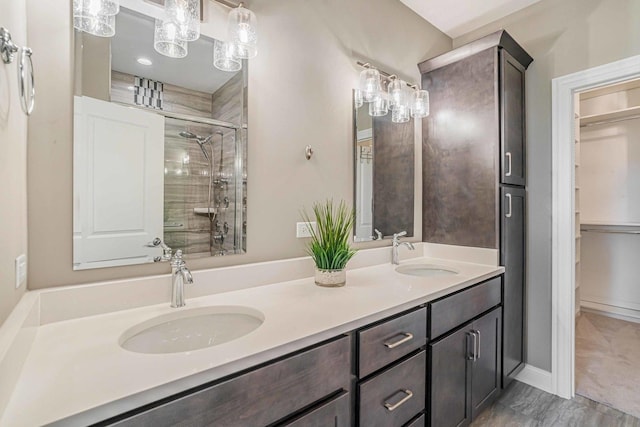 17035 Clover Dr, Orland Park, IL 60467 - bathroom featuring double vanity and a tile shower