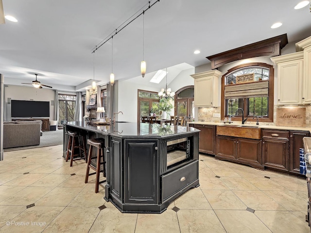 22 Yorkshire Woods, Oak Brook, IL 60523 - kitchen featuring cream cabinets, black microwave, decorative backsplash, and recessed lighting