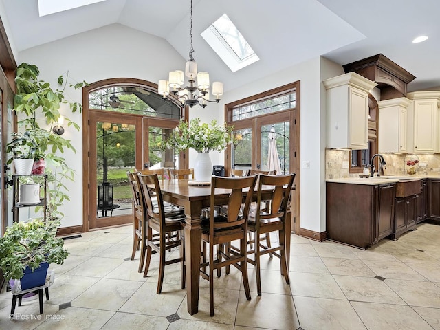 22 Yorkshire Woods, Oak Brook, IL 60523 - dining space with a skylight, a chandelier, french doors, high vaulted ceiling, and recessed lighting