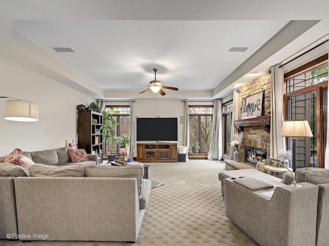 22 Yorkshire Woods, Oak Brook, IL 60523 - carpeted living area with a stone fireplace and a ceiling fan