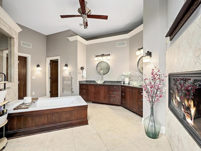 22 Yorkshire Woods, Oak Brook, IL 60523 - bathroom with double vanity, a bath, a ceiling fan, tile patterned flooring, and tasteful backsplash
