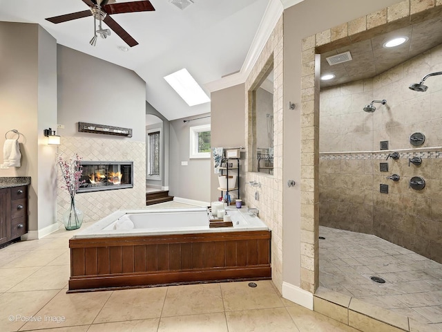 22 Yorkshire Woods, Oak Brook, IL 60523 - full bathroom featuring a bath, tiled shower, a ceiling fan, a fireplace, and vaulted ceiling