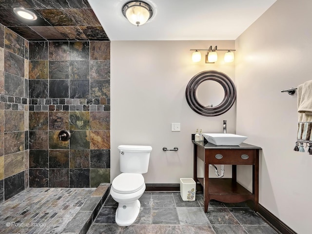 22 Yorkshire Woods, Oak Brook, IL 60523 - bathroom featuring vanity, tiled shower, and stone finish floors