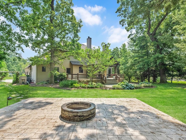 22 Yorkshire Woods, Oak Brook, IL 60523 - view of patio with an outdoor fire pit and a wooden deck