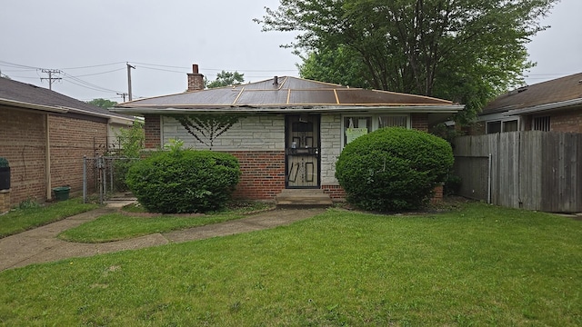 9426 S Peoria St, Chicago, IL 60620 - view of front of house with brick siding, a chimney, and entry steps